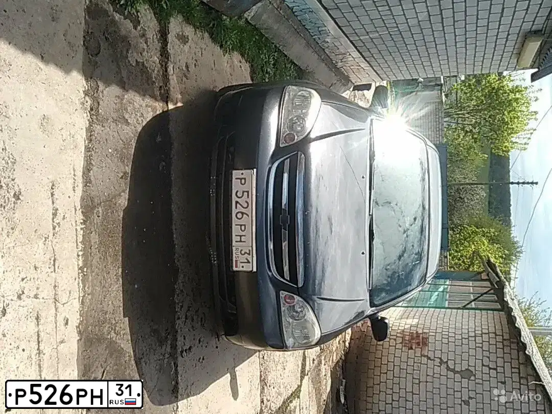 Фото автомобиля CHEVROLET LACETTI, 2008 — госномер М713ЕХ134. Цвет: ЧЕРНЫЙ