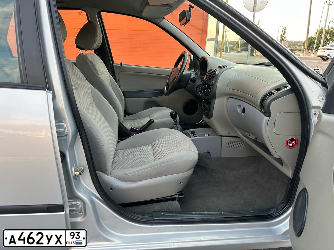 Фото автомобиля LADA 1119 KALINA, 2011 — госномер М021НС761. Цвет: СЕРЕБРИСТЫЙ