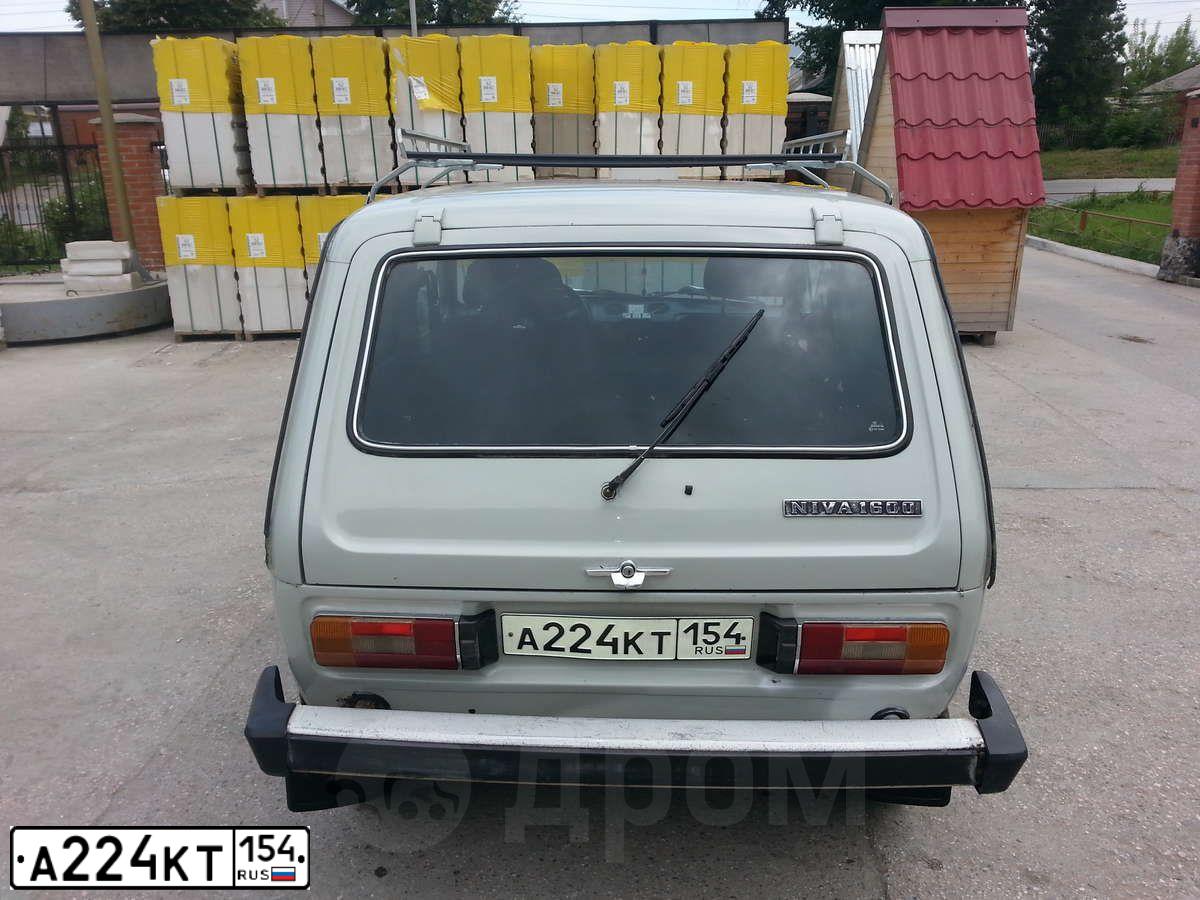 Фото автомобиля VAZ 2121 NIVA, 1990 — госномер А224КТ154. Цвет: СВЕТЛО-СЕРЫЙ