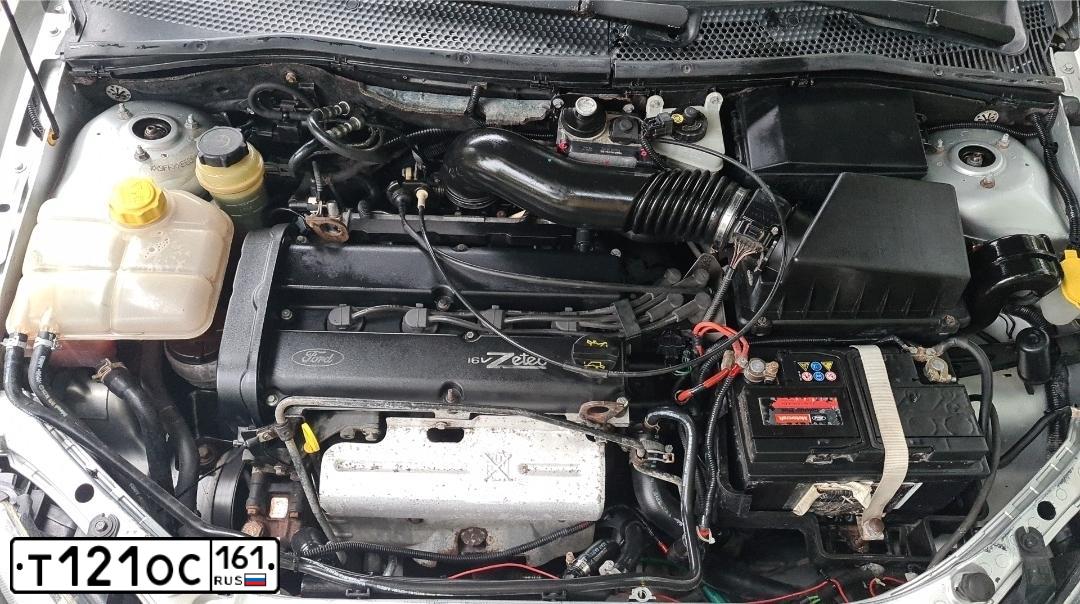 Фото автомобиля FORD FOCUS, 2004 — госномер Т121ОС161. Цвет: Серебристый