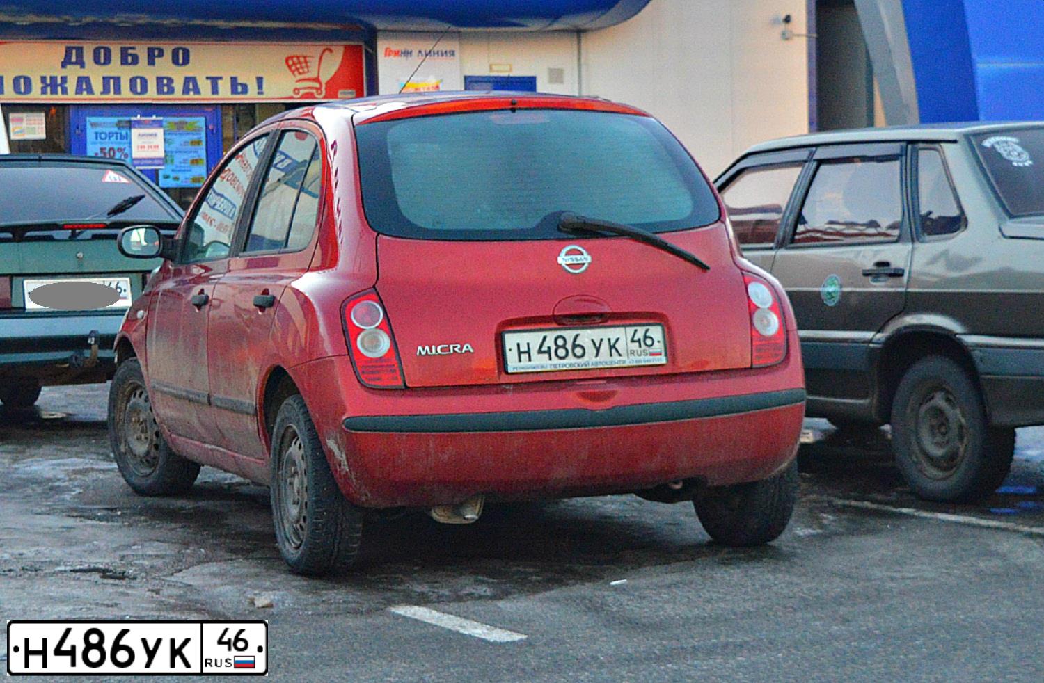 Фото автомобиля NISSAN MICRA, 2007 — госномер Н486УК46. Цвет: ВИШНЕВЫЙ