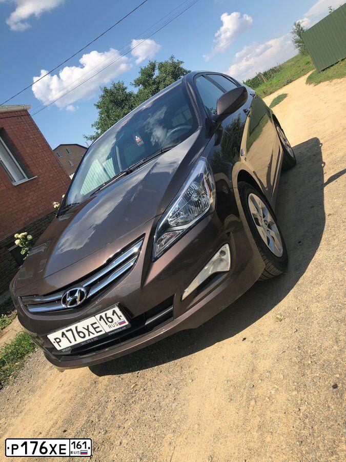 Фото автомобиля HYUNDAI SOLARIS, 2016 — госномер Р176ХЕ161. Цвет: Коричневый