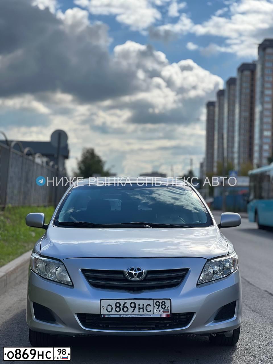 Фото автомобиля TOYOTA COROLLA, 2007 — госномер О869НС98. Цвет: СЕРЕБРИСТЫЙ