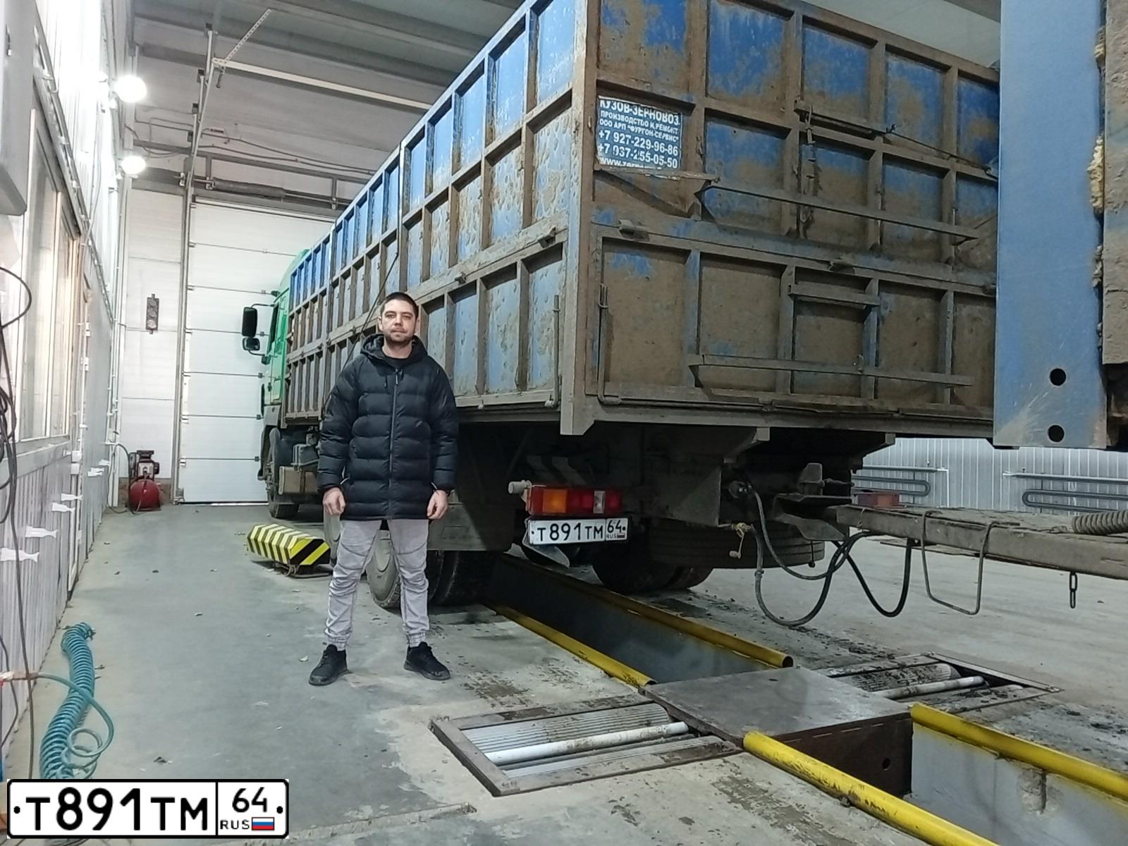Фото автомобиля MAZ MAN MAZ-MAN 6312 /6X4/, 2013 — госномер Т673ТМ64. Цвет: синий