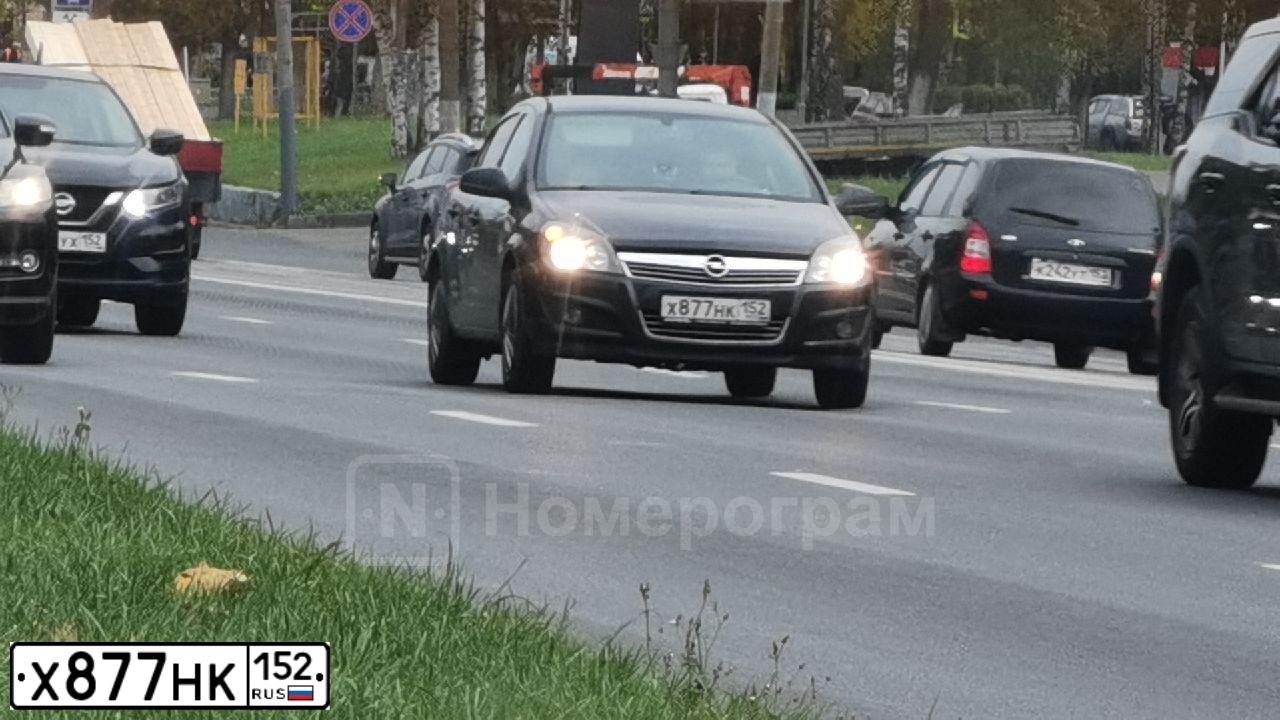 Фото автомобиля OPEL ASTRA, 2012 — госномер Х877НК152. Цвет: ЧЕРНЫЙ