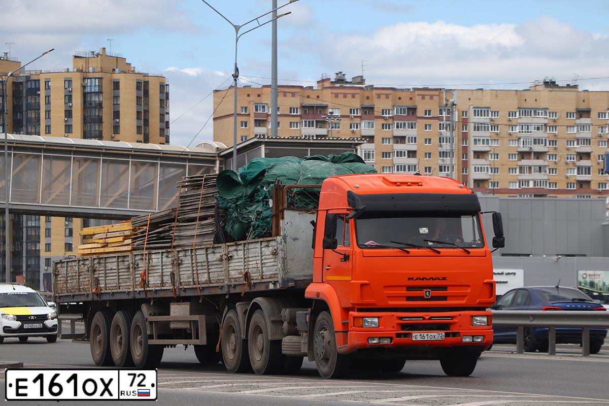 Фото автомобиля KAMAZ 6460 /6X4/, 2007 — госномер Е161ОХ72. Цвет: Оранжевый