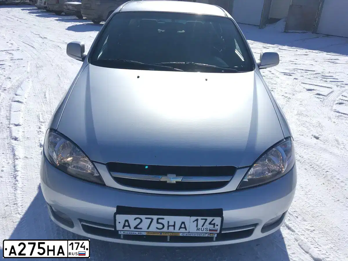 Фото автомобиля CHEVROLET LACETTI, 2010 — госномер Х185НС55. Цвет: СЕРЕБРИСТЫЙ