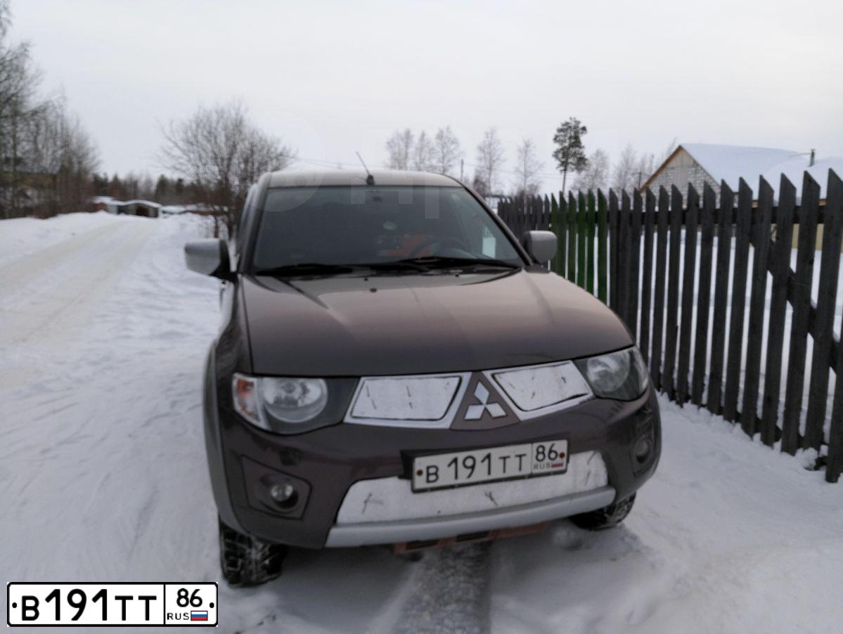 Фото автомобиля MITSUBISHI L 200, 2013 — госномер В191ТТ86. Цвет: Коричневый