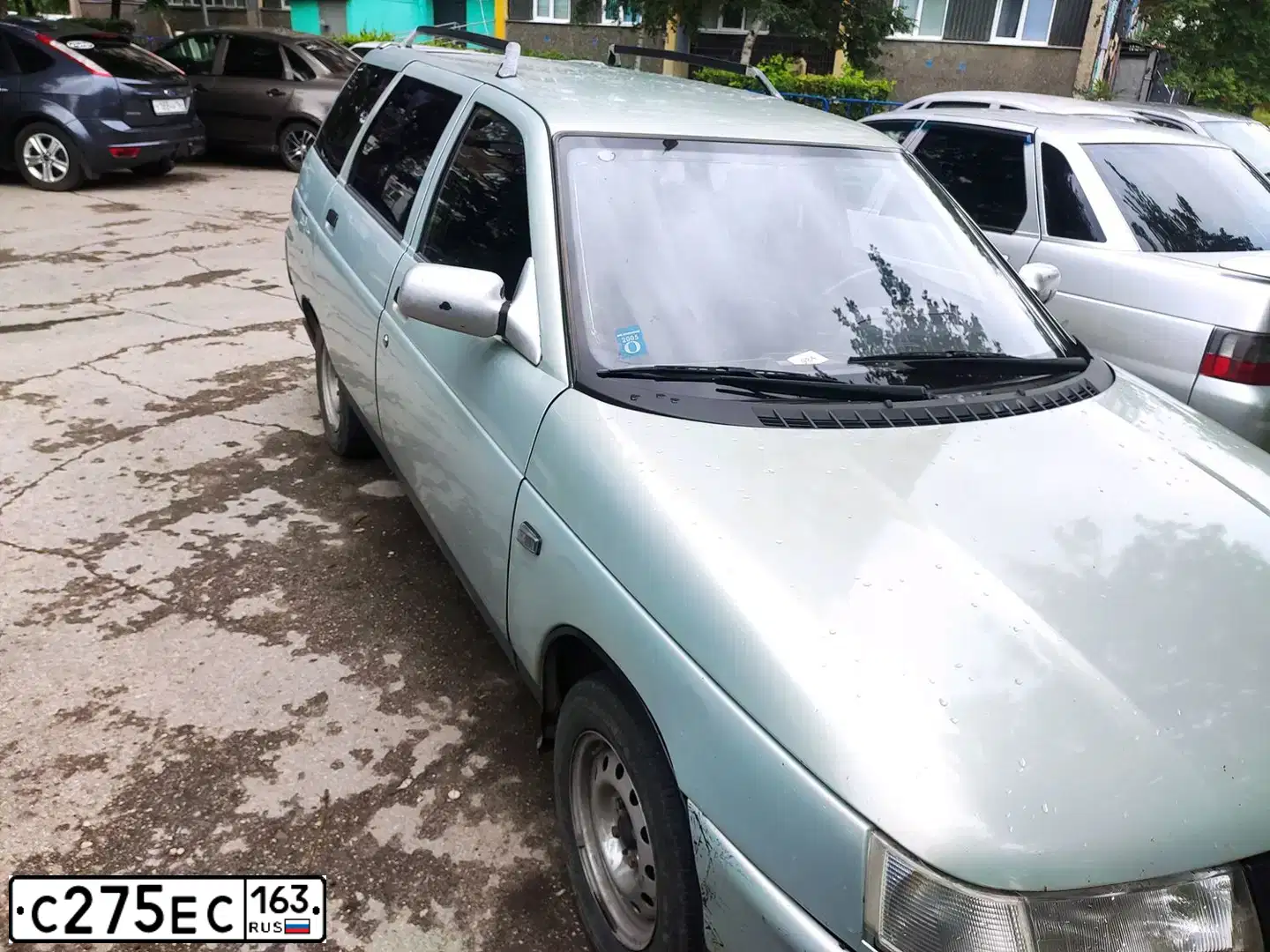 Фото автомобиля LADA 2111, 2000 — госномер Н975РМ790. Цвет: СЕРЕБРИСТО-ЖЕЛТО-ЗЕЛЕНЫЙ