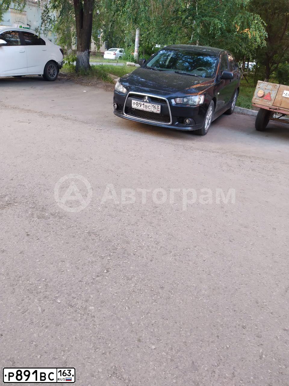Фото автомобиля MITSUBISHI LANCER, 2012 — госномер Р891ВС163. Цвет: ЧЕРНЫЙ