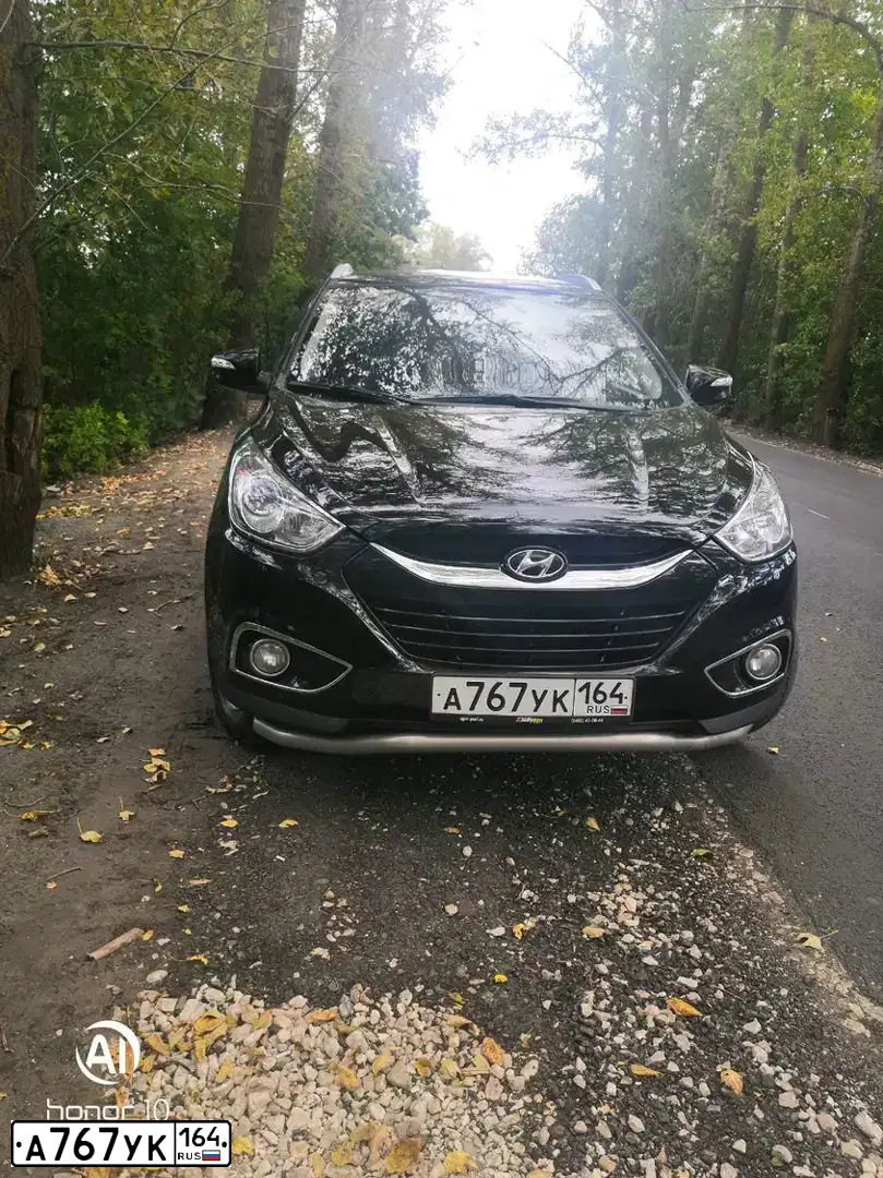 Фото автомобиля HYUNDAI IX35, 2011 — госномер А767УК164. Цвет: ЧЕРНЫЙ