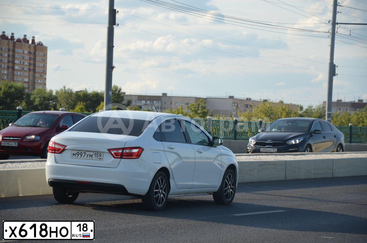Фото автомобиля CHEVROLET AVEO, 2007 — госномер Е093МК156. Цвет: Красный