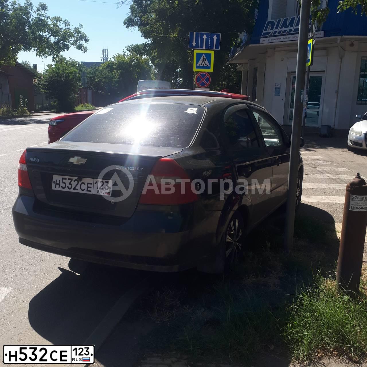 Фото автомобиля CHEVROLET AVEO, 2010 — госномер О024ВН323. Цвет: ЧЕРНЫЙ