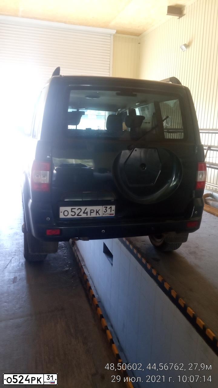 Фото автомобиля UAZ Z 3163 PATRIOT, 2015 — госномер О524РК31. Цвет: темно-зеленый металлик