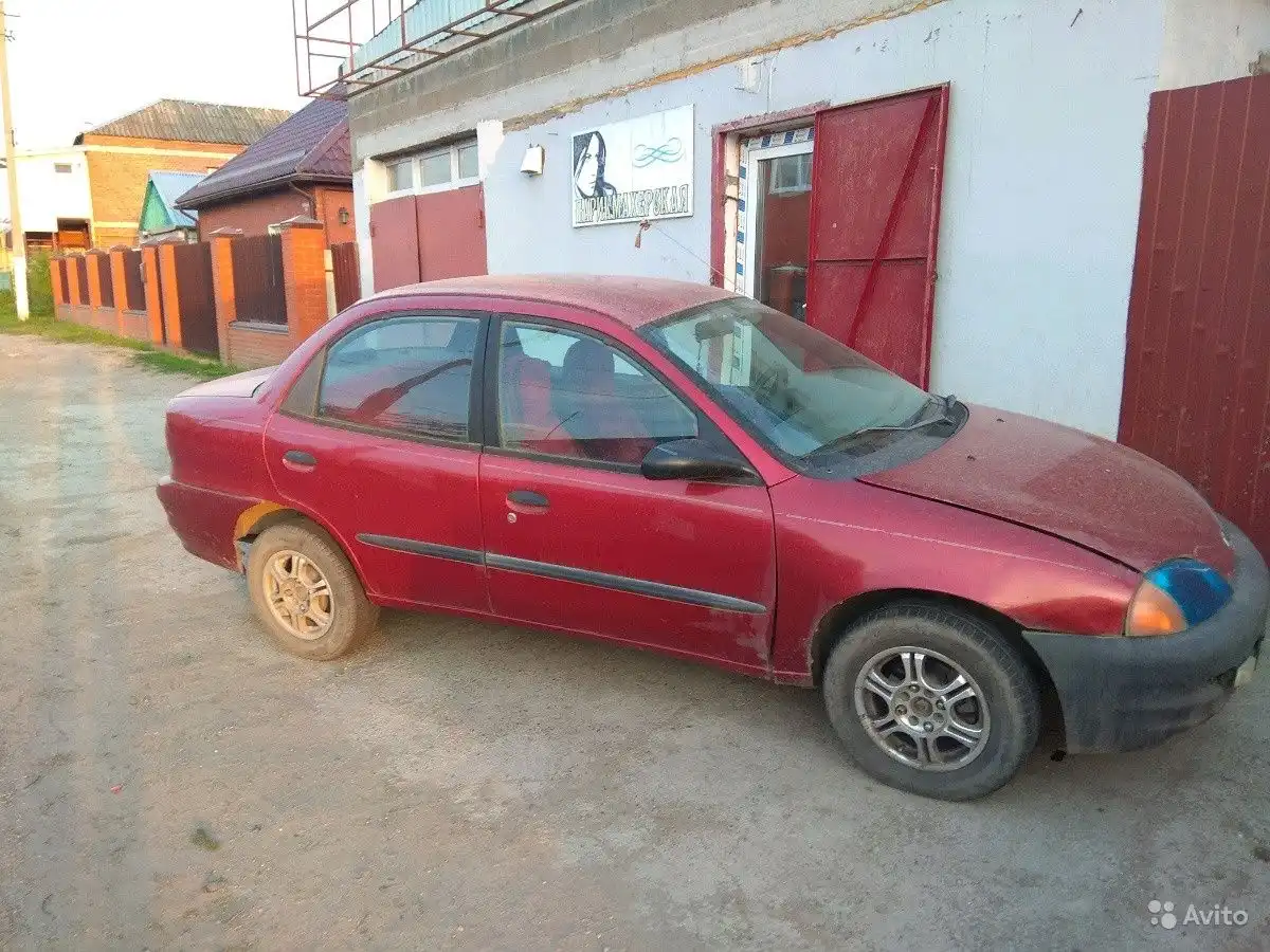 Фото автомобиля CHEVROLET METRO, 2000 — госномер С337ЕН323. Цвет: Красный