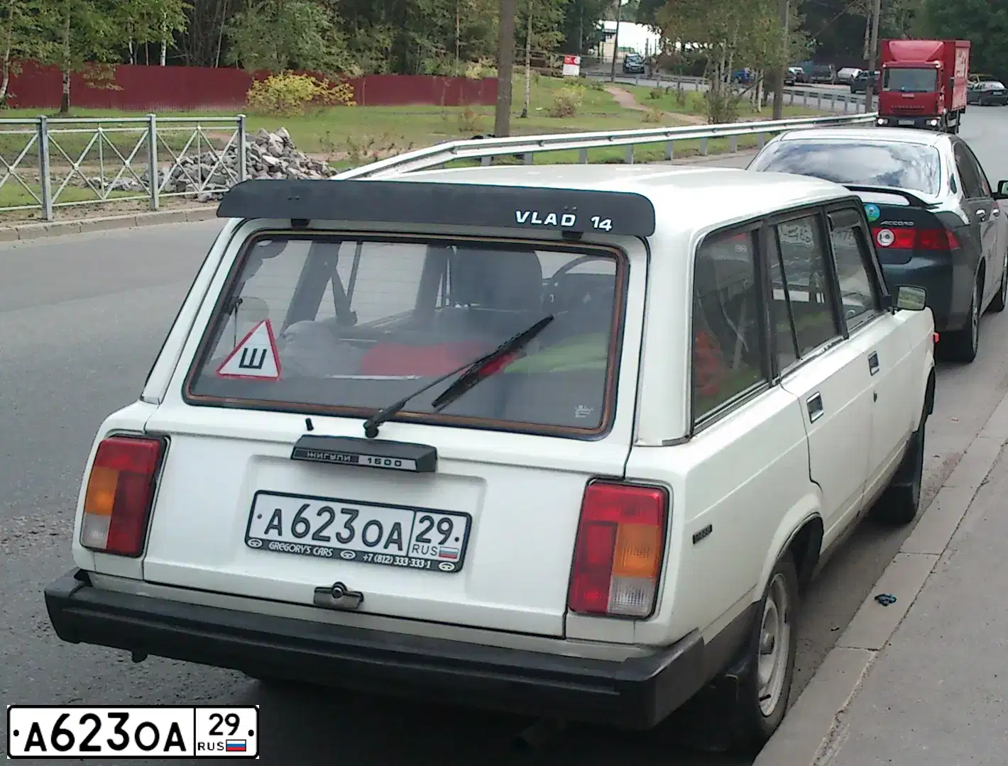 Фото автомобиля LADA 2104 LADA, 1997 — госномер А623ОА29. Цвет: Белый