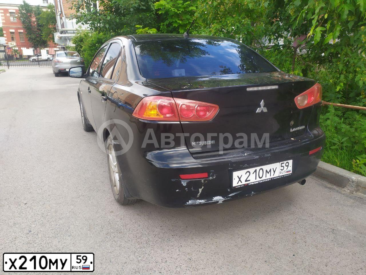Фото автомобиля MITSUBISHI LANCER, 2007 — госномер Х210МУ59. Цвет: ЧЕРНЫЙ