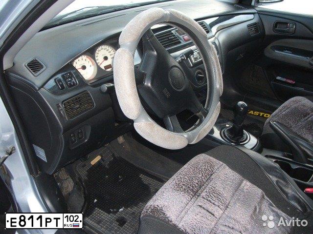 Фото автомобиля MITSUBISHI LANCER, 2004 — госномер Х167ВЕ102. Цвет: Серебристый