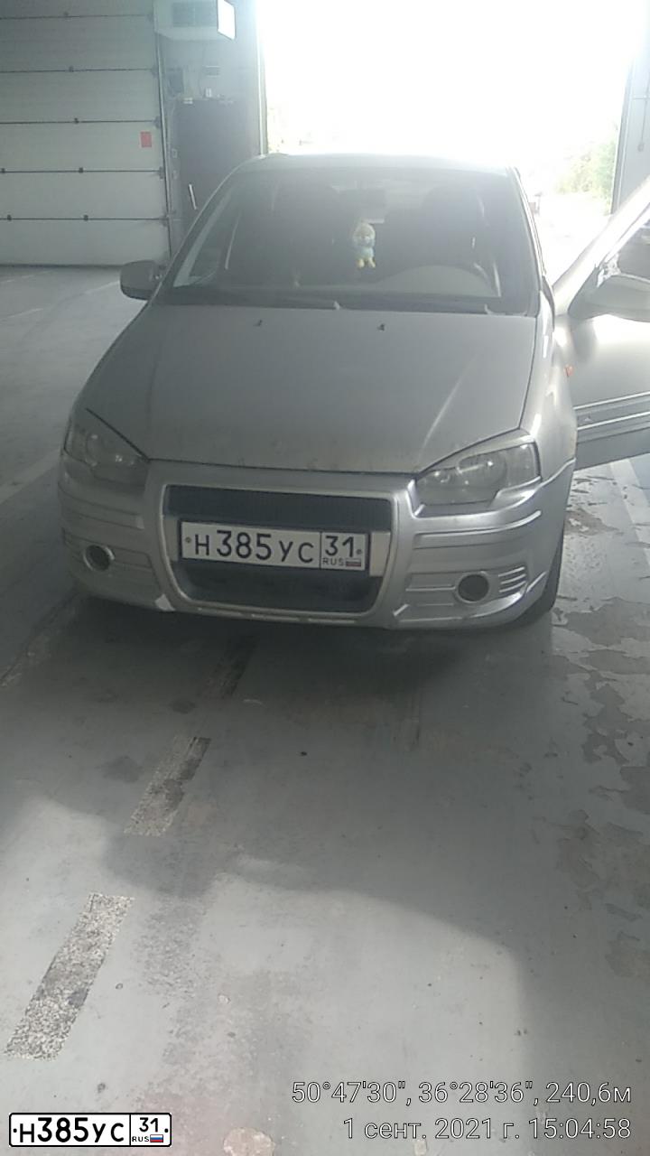 Фото автомобиля LADA 1119 KALINA, 2010 — госномер Н385УС31. Цвет: СЕРЕБРИСТЫЙ