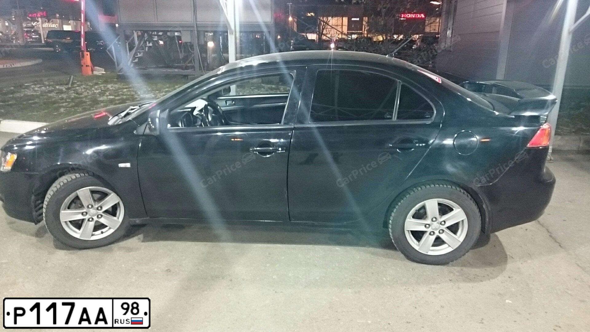Фото автомобиля MITSUBISHI LANCER, 2008 — госномер Т813МР136. Цвет: ЧЕРНЫЙ