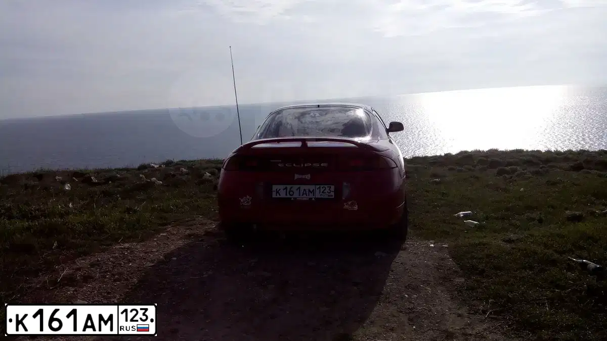 Фото автомобиля MITSUBISHI ECLIPSE, 1997 — госномер К161АМ123. Цвет: Красный