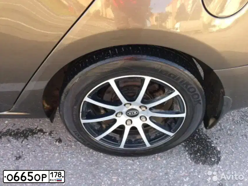 Фото автомобиля KIA CERATO, 2010 — госномер У402КУ05. Цвет: бронзовый