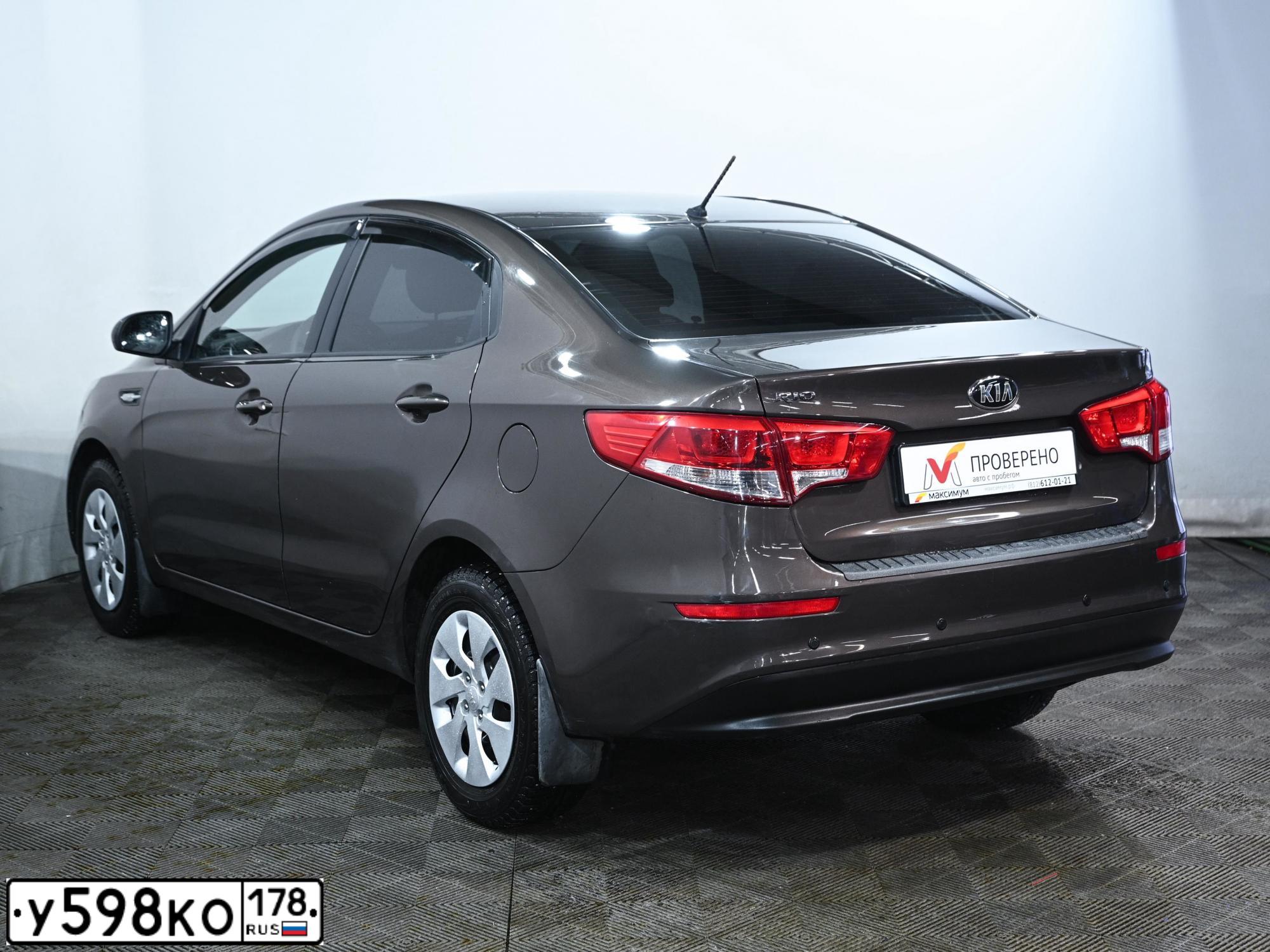 Фото автомобиля KIA RIO, 2016 — госномер Т626АС79. Цвет: Коричневый