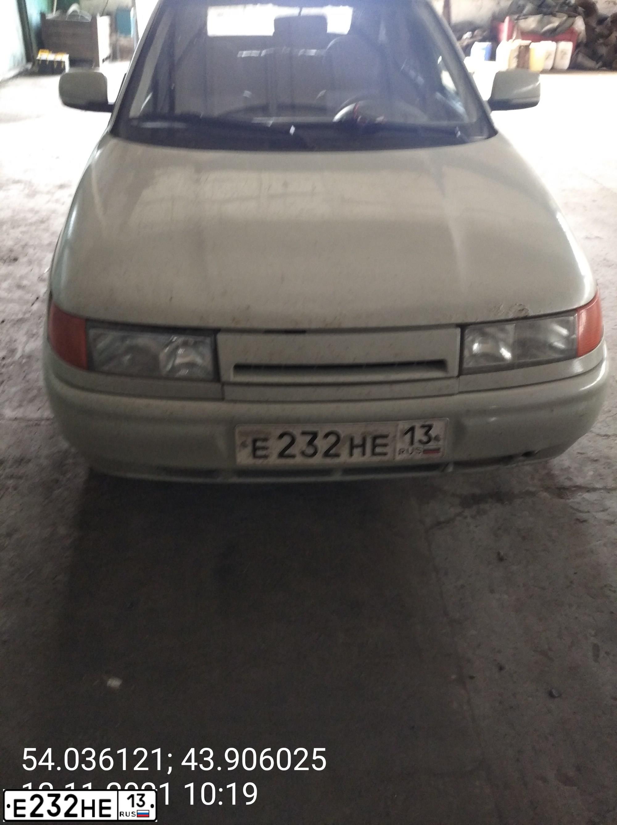 Фото автомобиля LADA 2112, 2005 — госномер Е232НЕ13. Цвет: МОЛОЧНО-БЕЛЫЙ СЕРЕБРИСТЫЙ