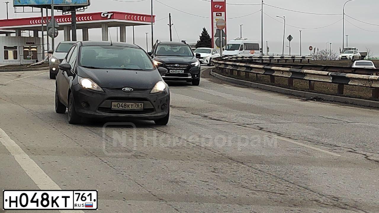 Фото автомобиля FORD FIESTA / ASPIRE, 2010 — госномер Н048КТ761. Цвет: ЧЕРНЫЙ