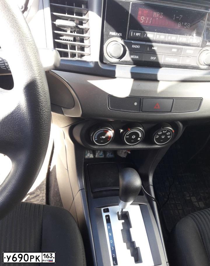 Фото автомобиля MITSUBISHI LANCER, 2014 — госномер М248ЕУ73. Цвет: Белый