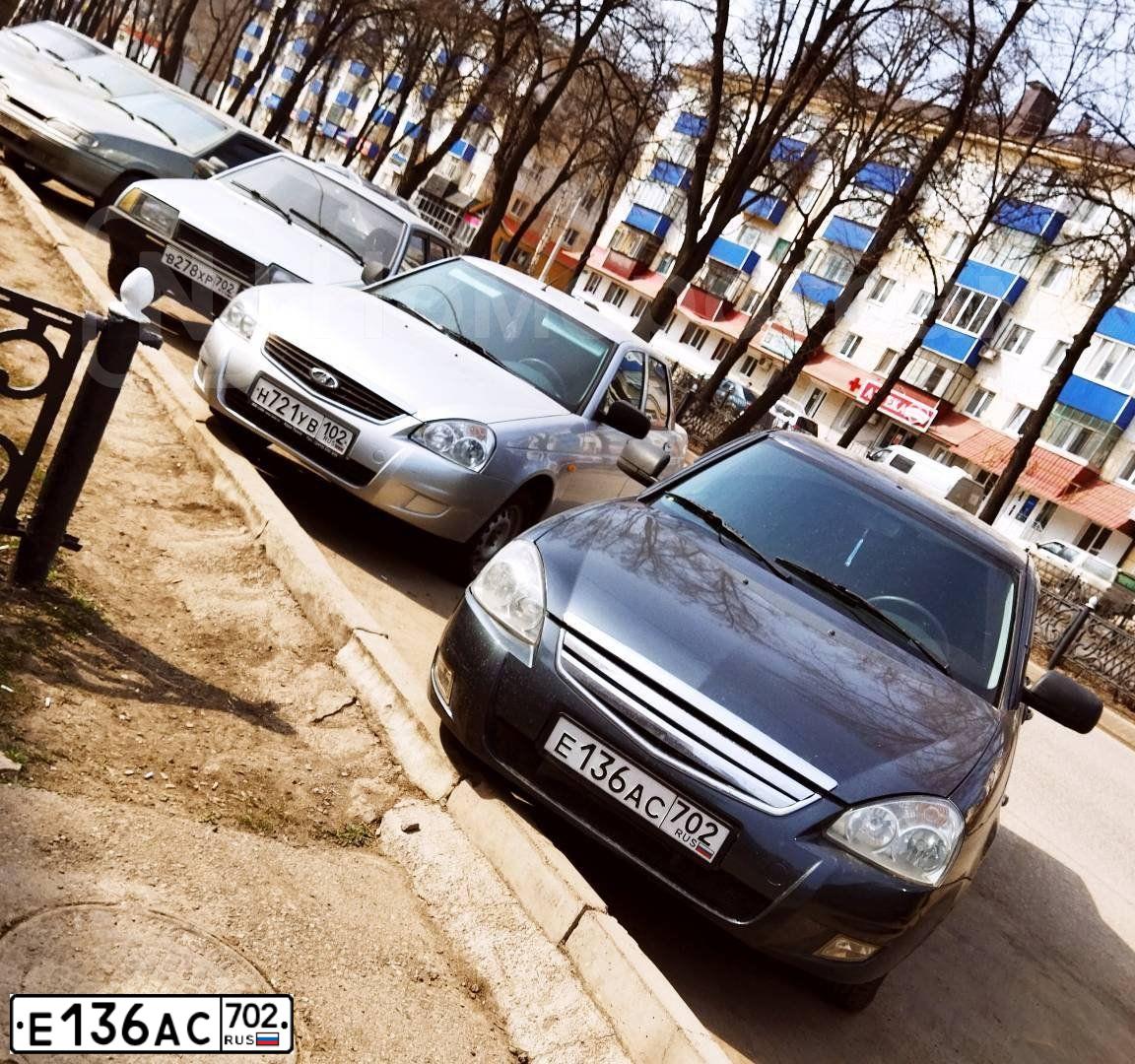 Фото автомобиля LADA 2170 PRIORA, 2012 — госномер Е136АС702. Цвет: Серо-Синий