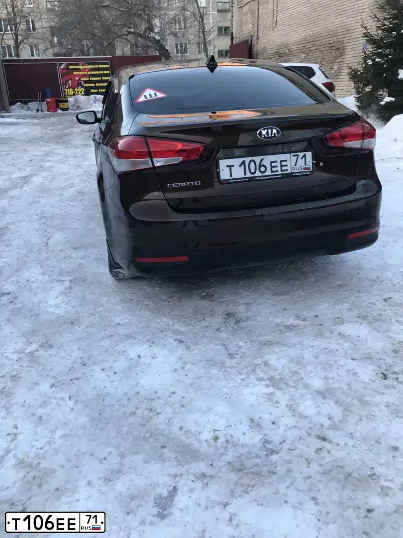 Фото автомобиля KIA CERATO, 2017 — госномер Т198ТВ31. Цвет: Коричневый