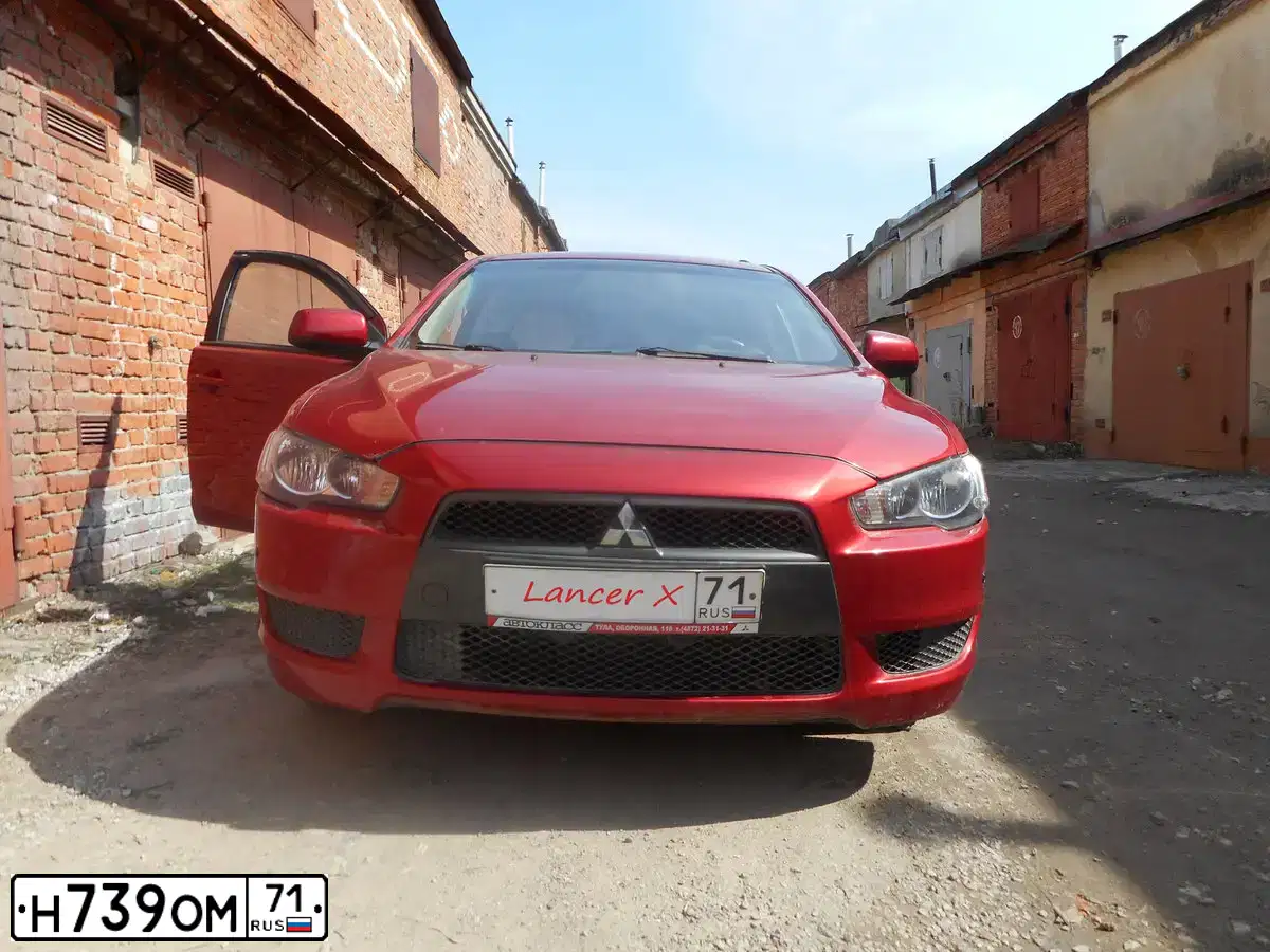 Фото автомобиля MITSUBISHI LANCER, 2008 — госномер У276ОС71. Цвет: Красный
