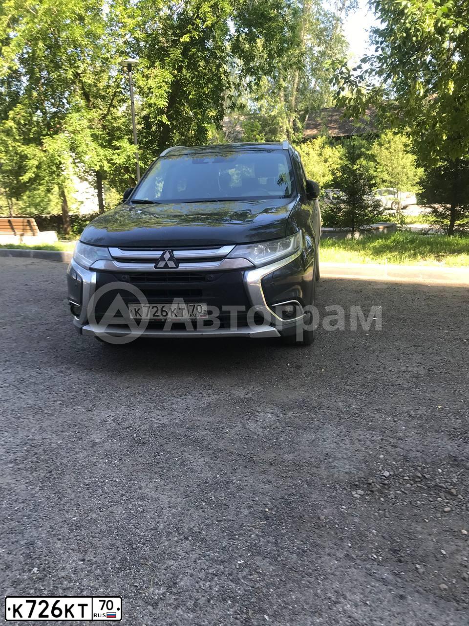 Фото автомобиля MITSUBISHI OUTLANDER, 2016 — госномер К726КТ70. Цвет: ЧЕРНЫЙ