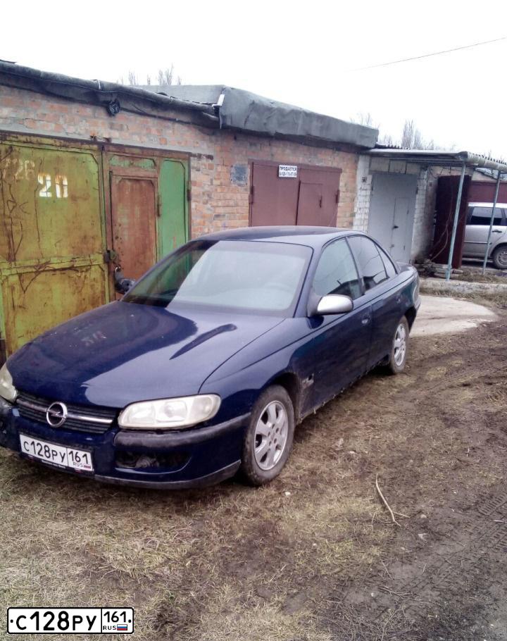 Фото автомобиля OPEL OMEGA, 1999 — госномер О715МС78. Цвет: синий