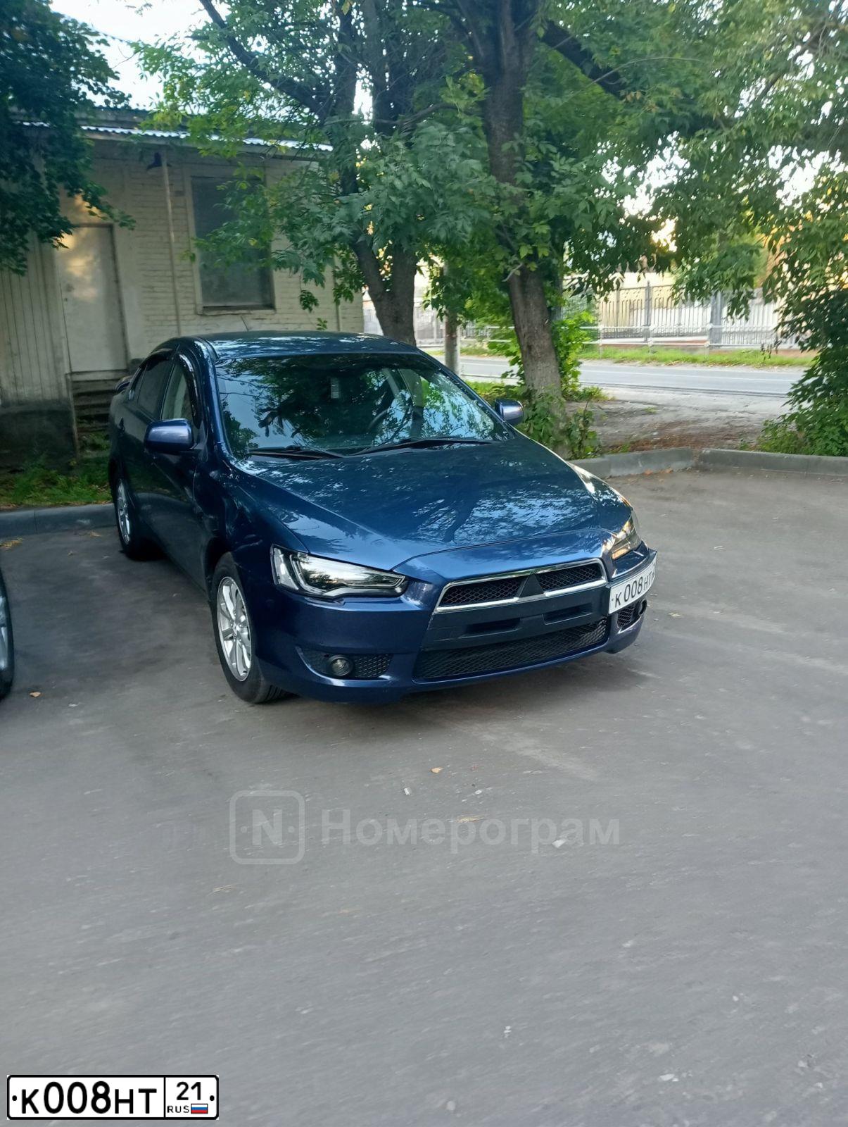 Фото автомобиля MITSUBISHI LANCER, 2011 — госномер М464СТ21. Цвет: синий