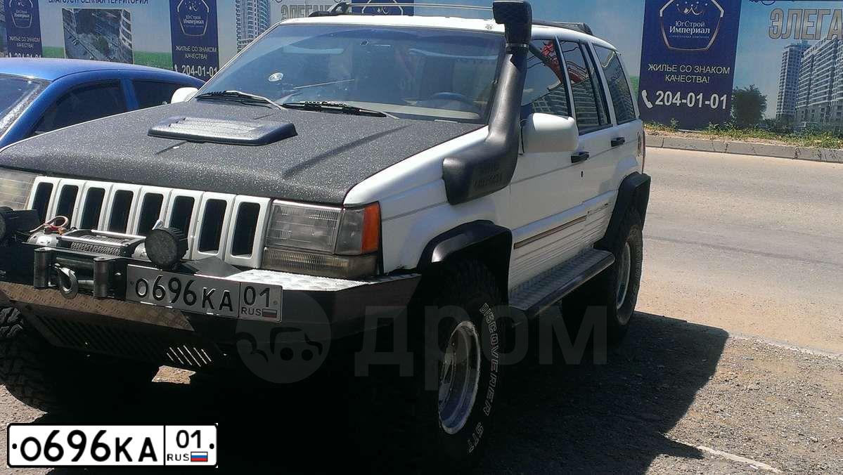 Фото автомобиля JEEP GRAND CHEROKEE, 1993 — госномер О696КА01. Цвет: БЕЛЫЙ