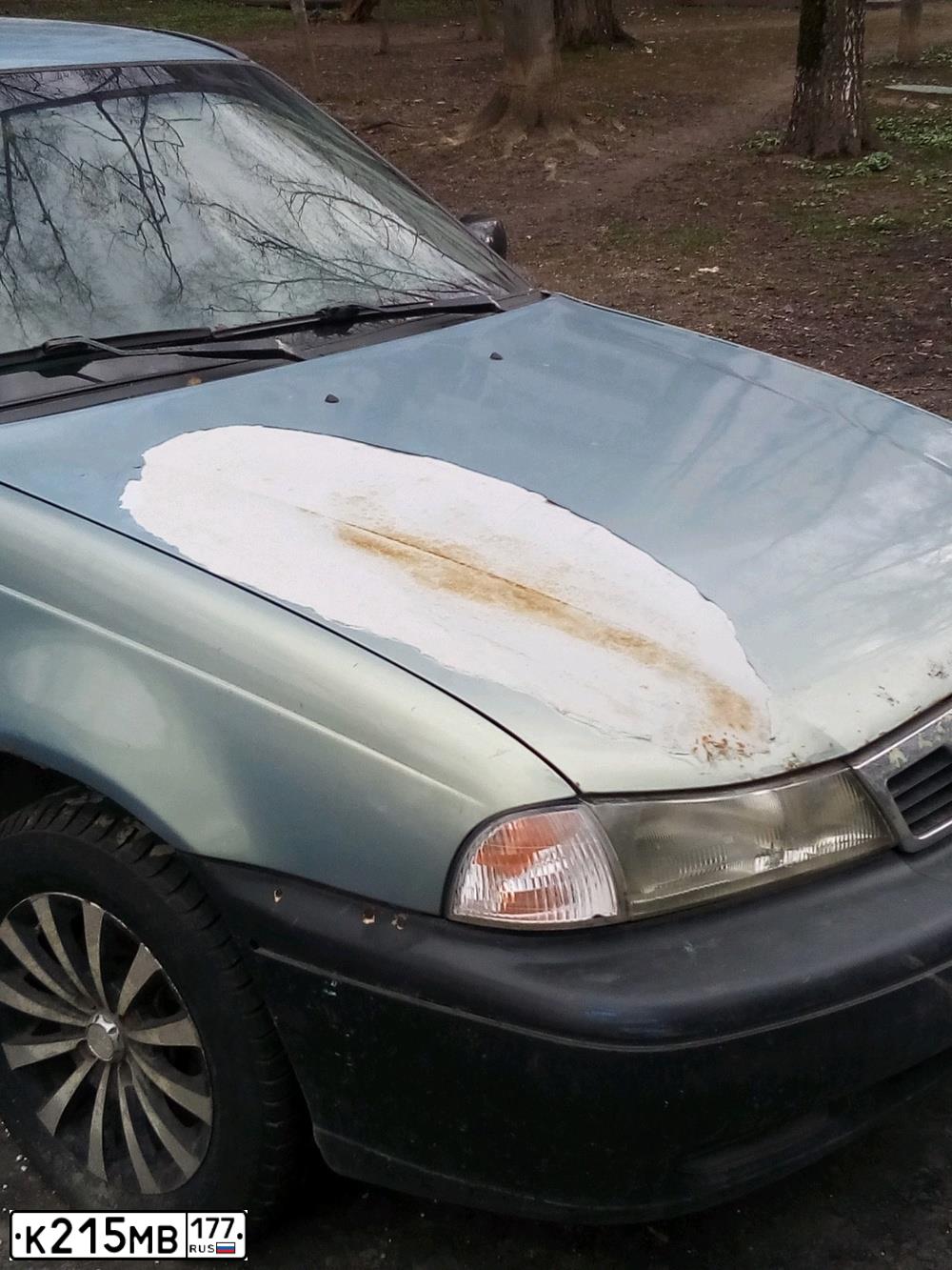 Фото автомобиля DAEWOO NEXIA, 2006 — госномер К215МВ177. Цвет: СЕРО-ГОЛУБОЙ