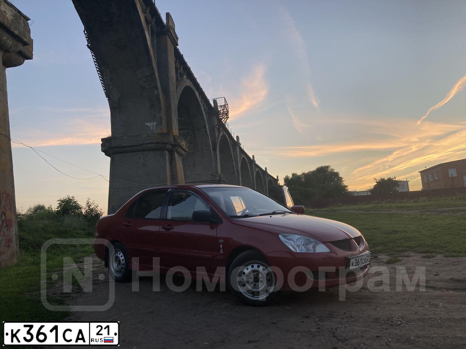 Фото автомобиля MITSUBISHI LANCER, 2005 — госномер К361СА21. Цвет: Красный