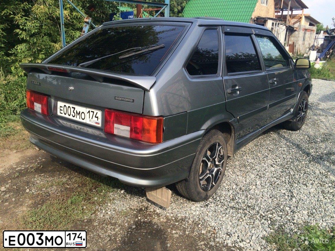 Фото автомобиля LADA 2114 SAMARA, 2010 — госномер Е003МО174. Цвет: Средний серо-зеленый мет.