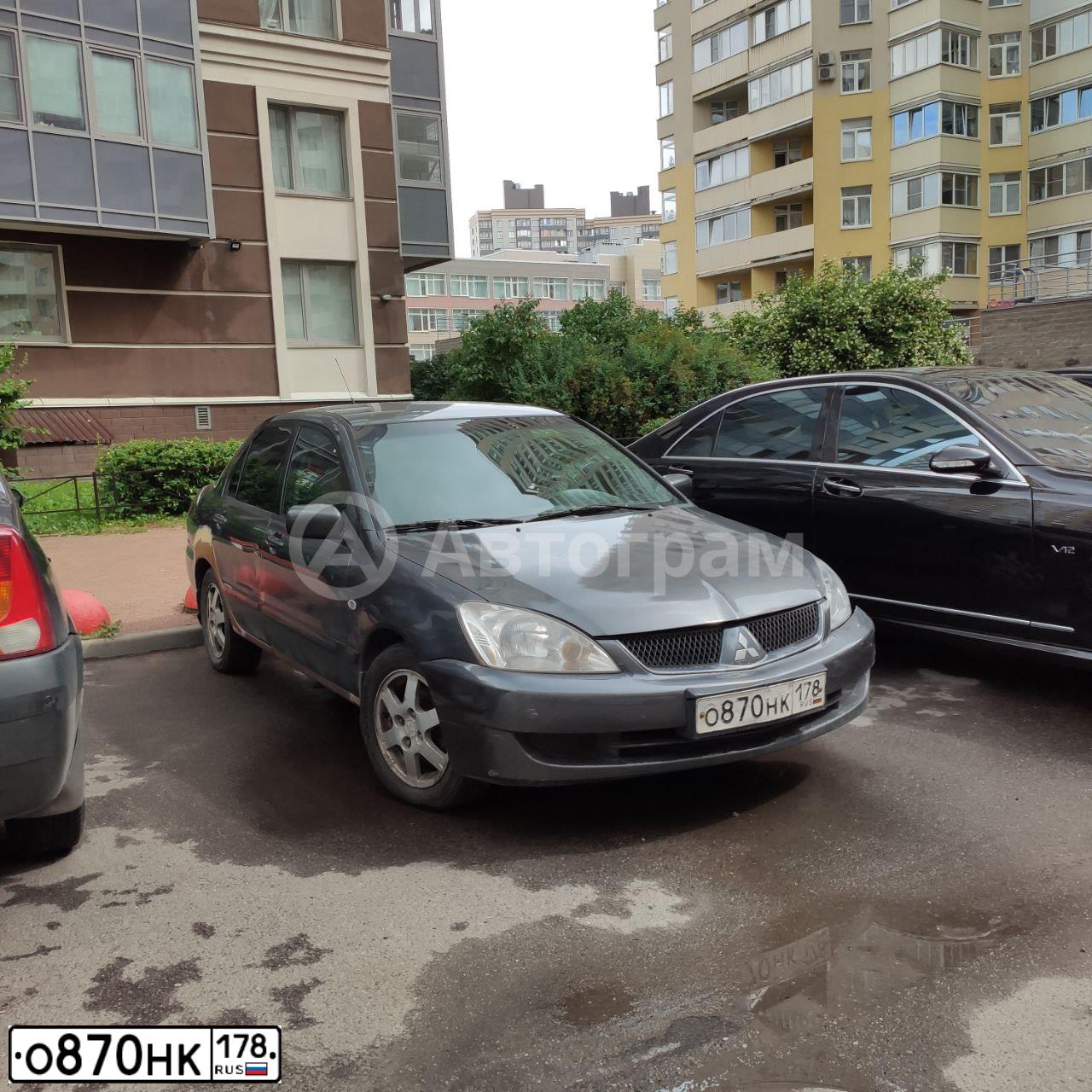 Фото автомобиля MITSUBISHI LANCER, 2005 — госномер М056СХ67. Цвет: СЕРЫЙ