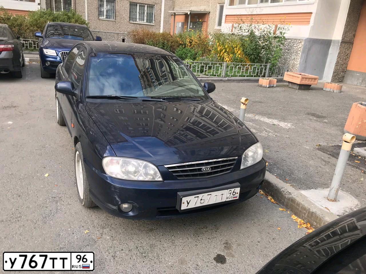 Фото автомобиля KIA SPECTRA, 2008 — госномер Н768ЕН196. Цвет: ТЕМНО-СИНИЙ