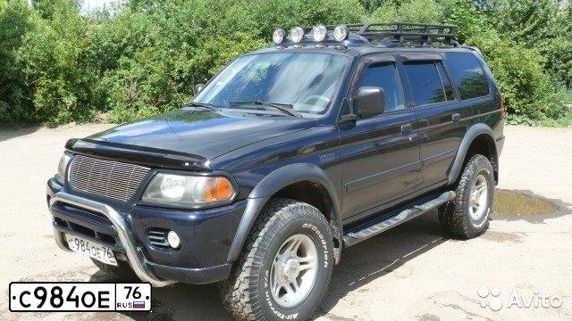 Фото автомобиля MITSUBISHI MONTERO, 2002 — госномер А484РС702. Цвет: ТЕМНО-СИНИЙ