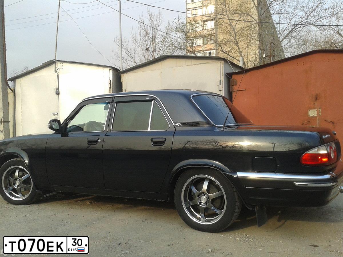 Фото автомобиля GAZ 3110 WOLGA, 2007 — госномер Т070ЕК30. Цвет: ЧЕРНЫЙ