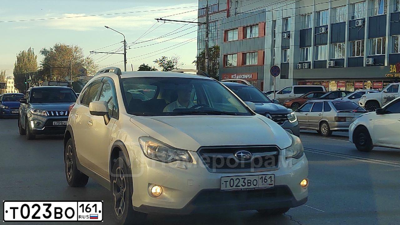 Фото автомобиля SUBARU IMPREZA, 2012 — госномер Т023ВО161. Цвет: Белый