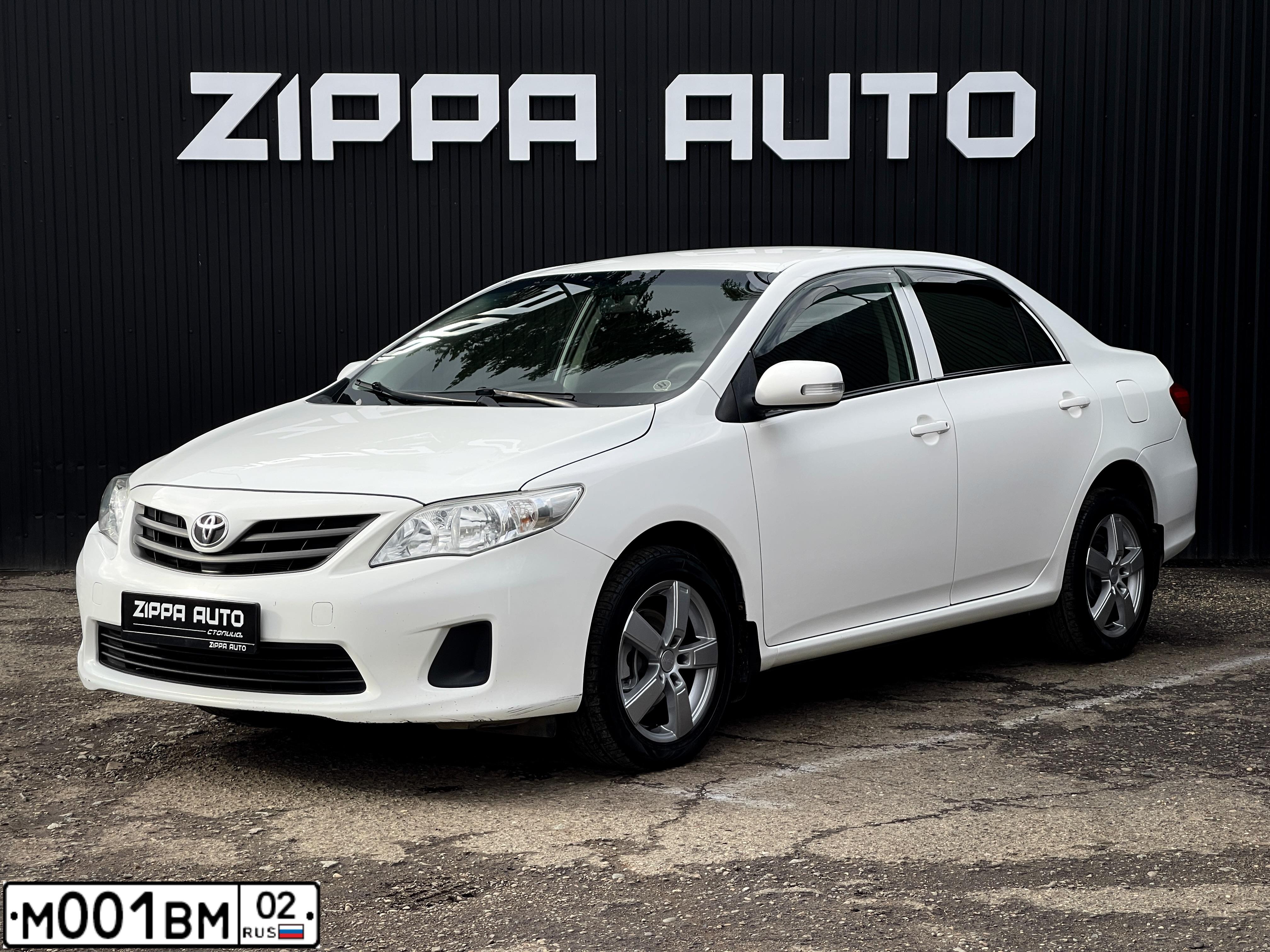Фото автомобиля TOYOTA COROLLA, 2011 — госномер М001ВМ02. Цвет: БЕЛЫЙ