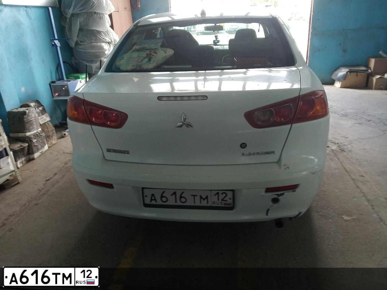 Фото автомобиля MITSUBISHI LANCER, 2008 — госномер А702НТ252. Цвет: Белый