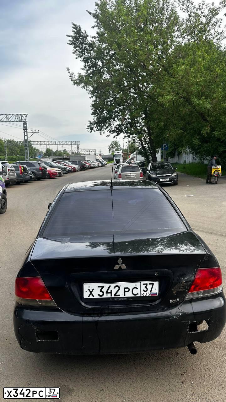 Фото автомобиля MITSUBISHI LANCER, 2005 — госномер Х342РС37. Цвет: ЧЕРНЫЙ