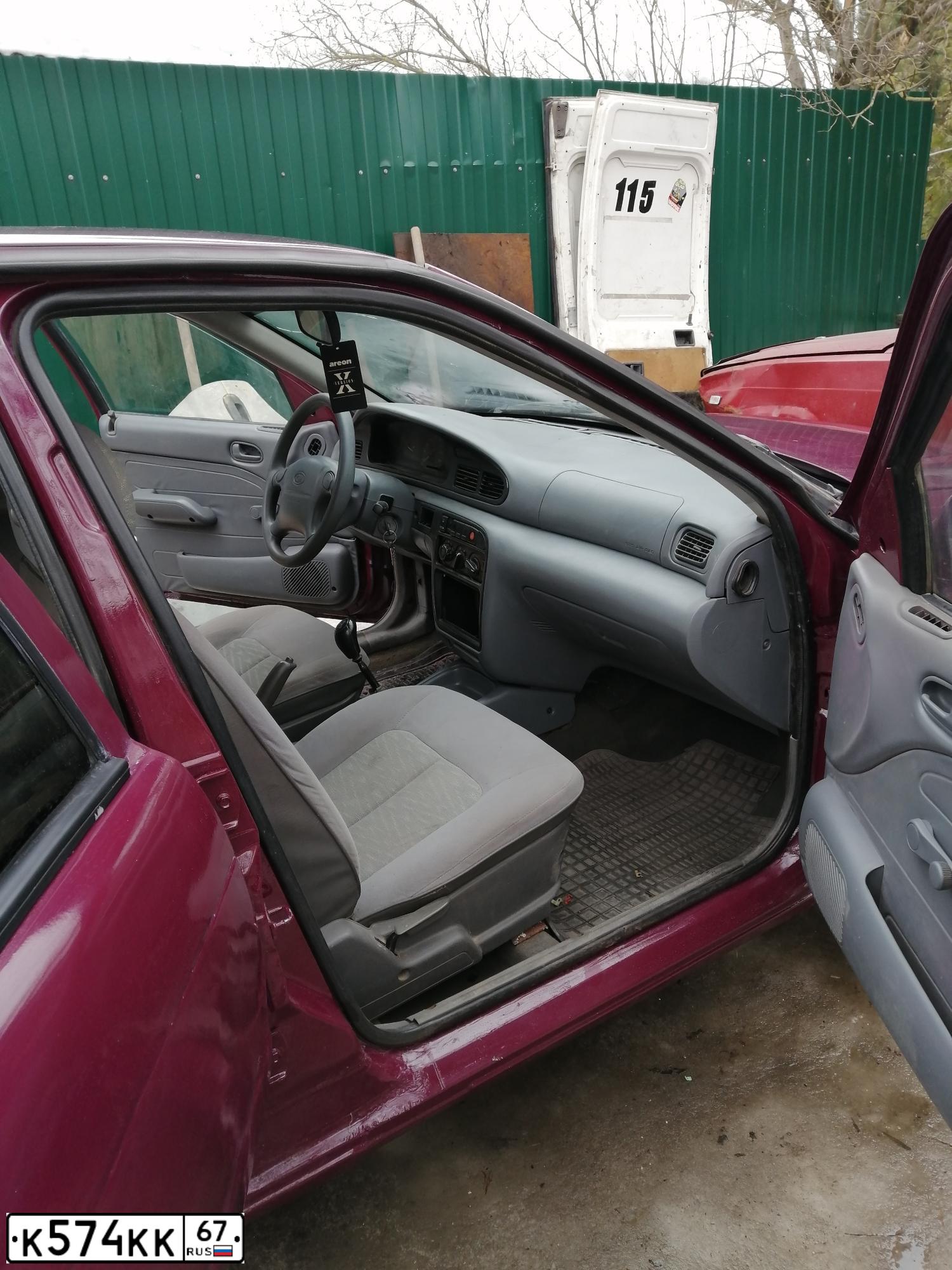 Фото автомобиля KIA SEPHIA, 1996 — госномер К574КК67. Цвет: ВИШНЕВЫЙ