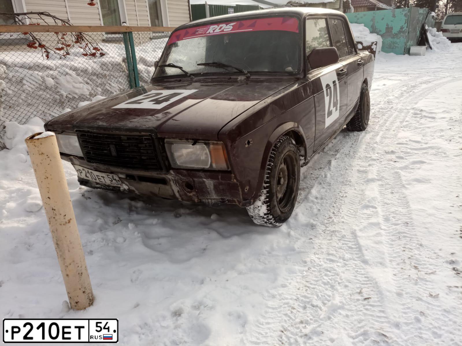 Фото автомобиля LADA 2107 LADA, 2006 — госномер Р210ЕТ54. Цвет: ТЕМНО ВИШНЕВЫЙ